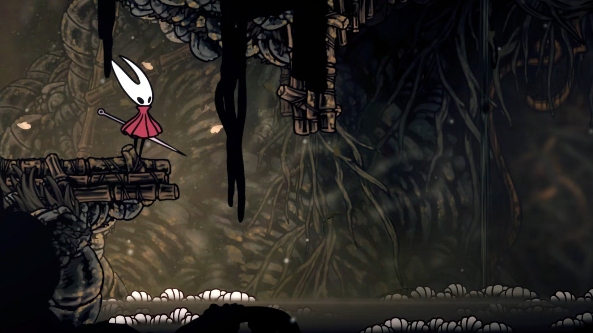 Hornet in Hollow Knight: Silksong stands on the edge of a ledge in Sinner's Road and looks down at a body of water below which is crawling with worms.