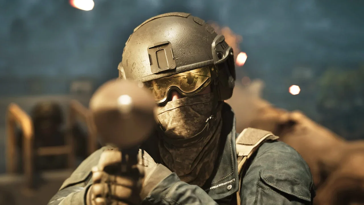 A soldier with a facemask, golden goggles nad a helmet aiming a rocket launcher right at you in Wardogs.